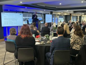 Mark Pendlington (Chair of the Suffolk Business Board) addresses a room of board members and other local business leaders